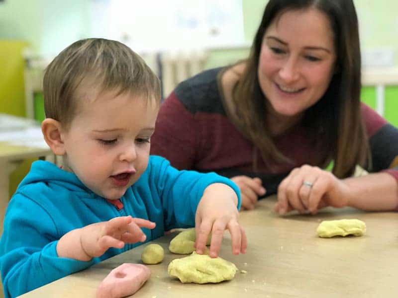 Home-Start volunteer with child making pastry